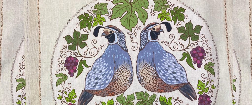 Linen tea towels with a quail and grape vine design