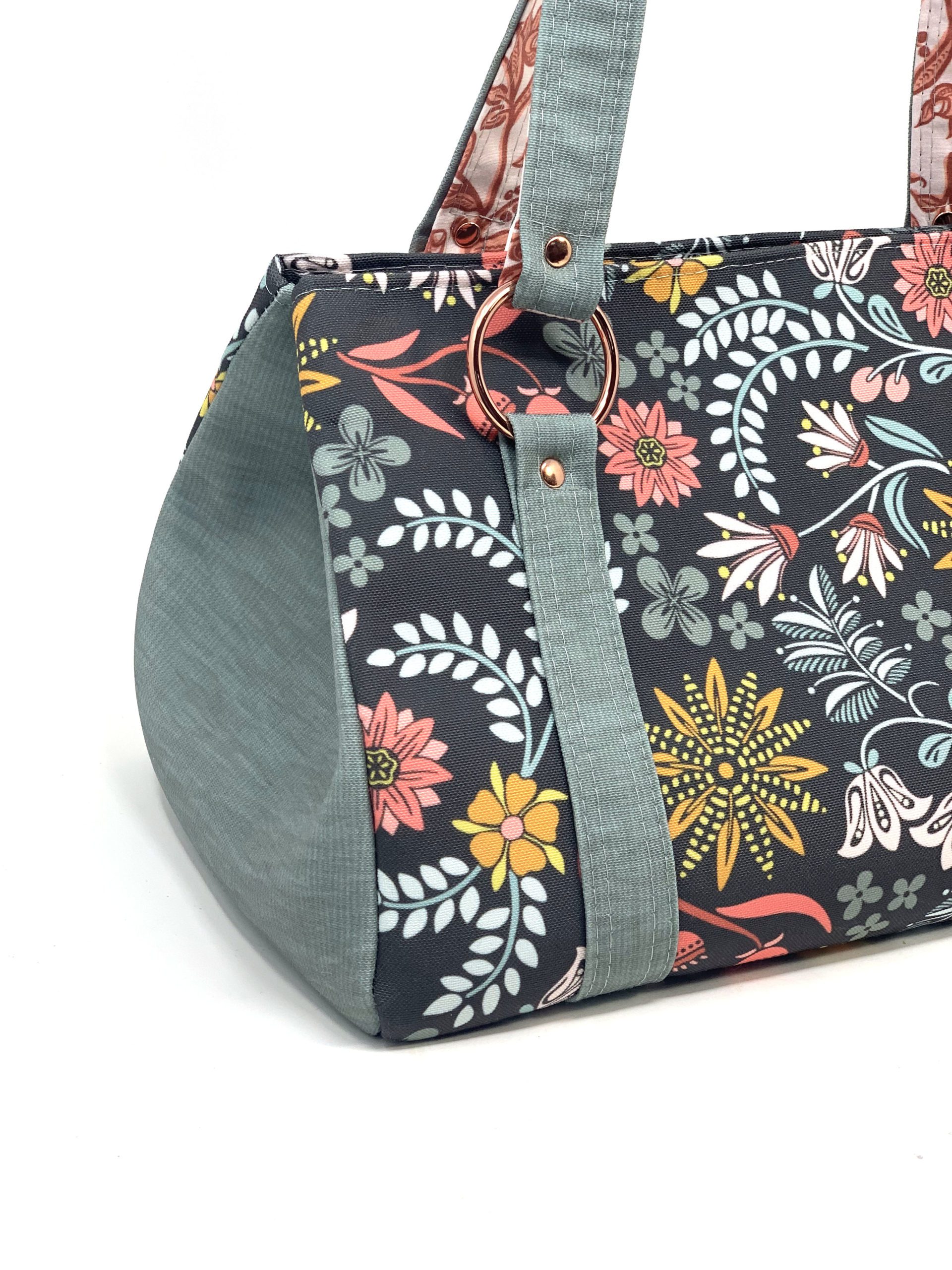 the Happy Handbag sewn in custom floral fabric with copper hardware